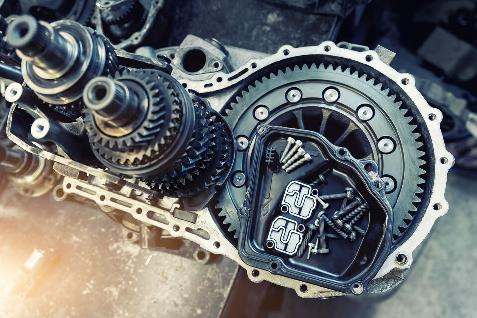 Close-up of transmission gears and torque converter housing during a rebuild