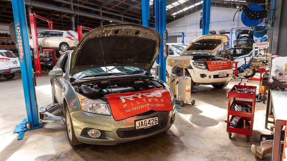 Cars raised on hoists in the workshop with RYCO Filters branding