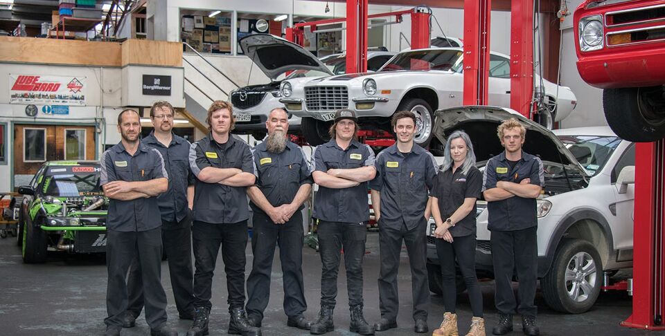 Marshall Transmissions & Automotive team standing together in the workshop